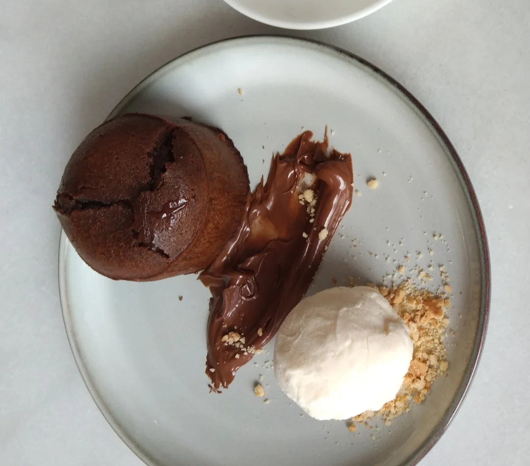 Warm dark chocolate cake with vanilla ice cream