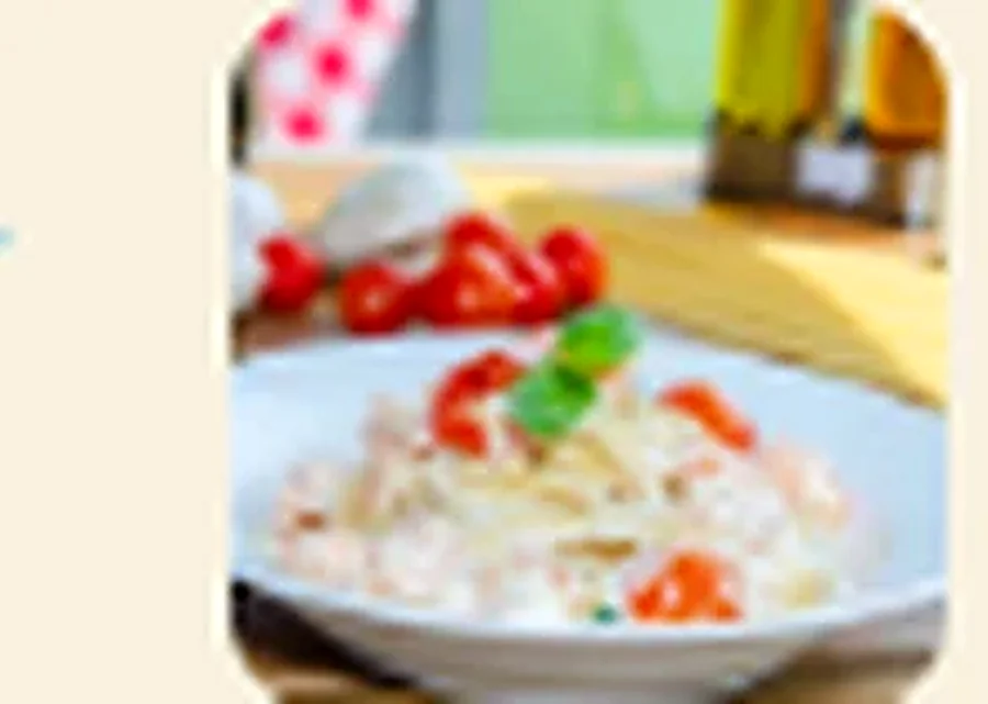 Linguine pasta with shrimp and cherry tomatoes in white sauce